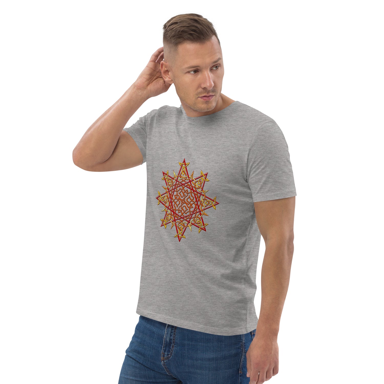 A young man wearing a heather grey Xigfireon graphic organic cotton t-shirt featuring the Fire Colour iteration of the `Morning Star Fire` Celtic knot design. The `Morning Star Fire` Celtic knot represents our benevolent Father Sun.