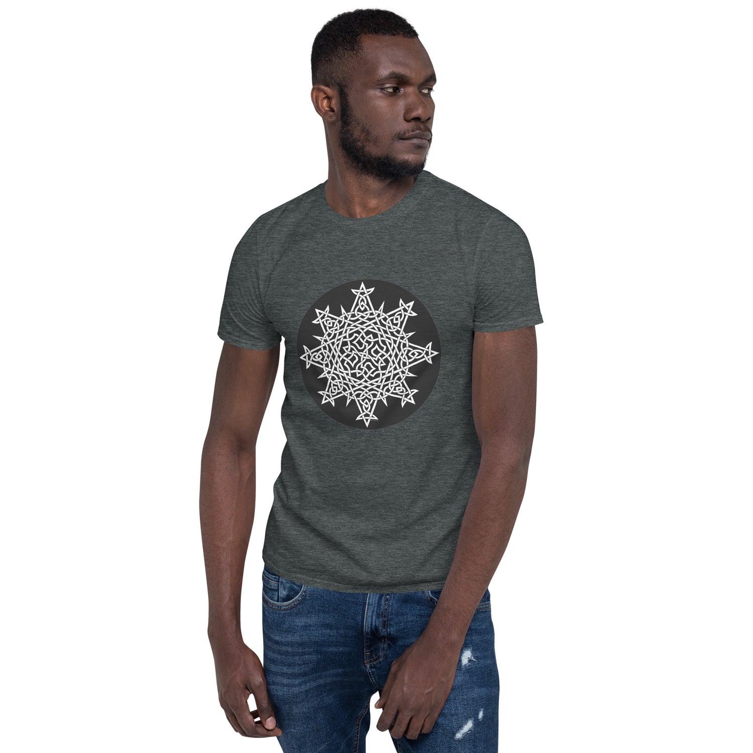 A young man wearing a dark heather Xigfireon graphic t-shirt featuring the Black & White Circle iteration of the `Morning Star Fire` Celtic knot design. The `Morning Star Fire` Celtic knot represents Father Sun and the eternal Cosmic Light.