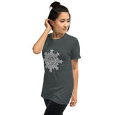 A young woman wearing a dark heather Xigfireon graphic t-shirt featuring the Black & White Hollow iteration of the `Morning Star Fire` Celtic knot design. The `Morning Star Fire` Celtic knot symbolizes the Sun.