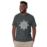 A young man wearing a dark heather Xigfireon graphic t-shirt featuring the Black & White Solid iteration of the `Morning Star Fire` Celtic knot design. The `Morning Star Fire` Celtic knot symbolizes the Sun.