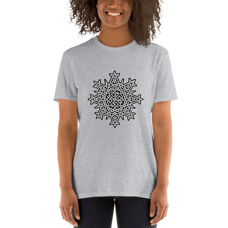 A young woman wearing a sport grey Xigfireon graphic t-shirt featuring the Black & White Solid iteration of the `Morning Star Fire` Celtic knot design. The `Morning Star Fire` Celtic knot represents Father Sun and the eternal Cosmic Light.