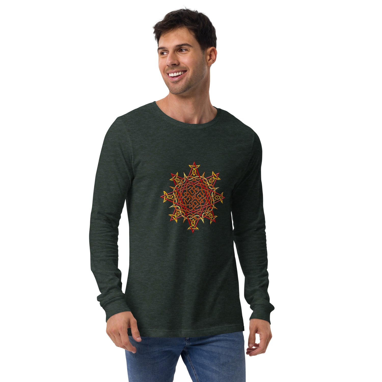 A young man wearing a heather forest green Xigfireon long sleeve graphic t-shirt featuring the Fire Colour iteration of the `Morning Star Fire` Celtic knot design. The `Morning Star Fire` Celtic knot symbolizes Father Earth.