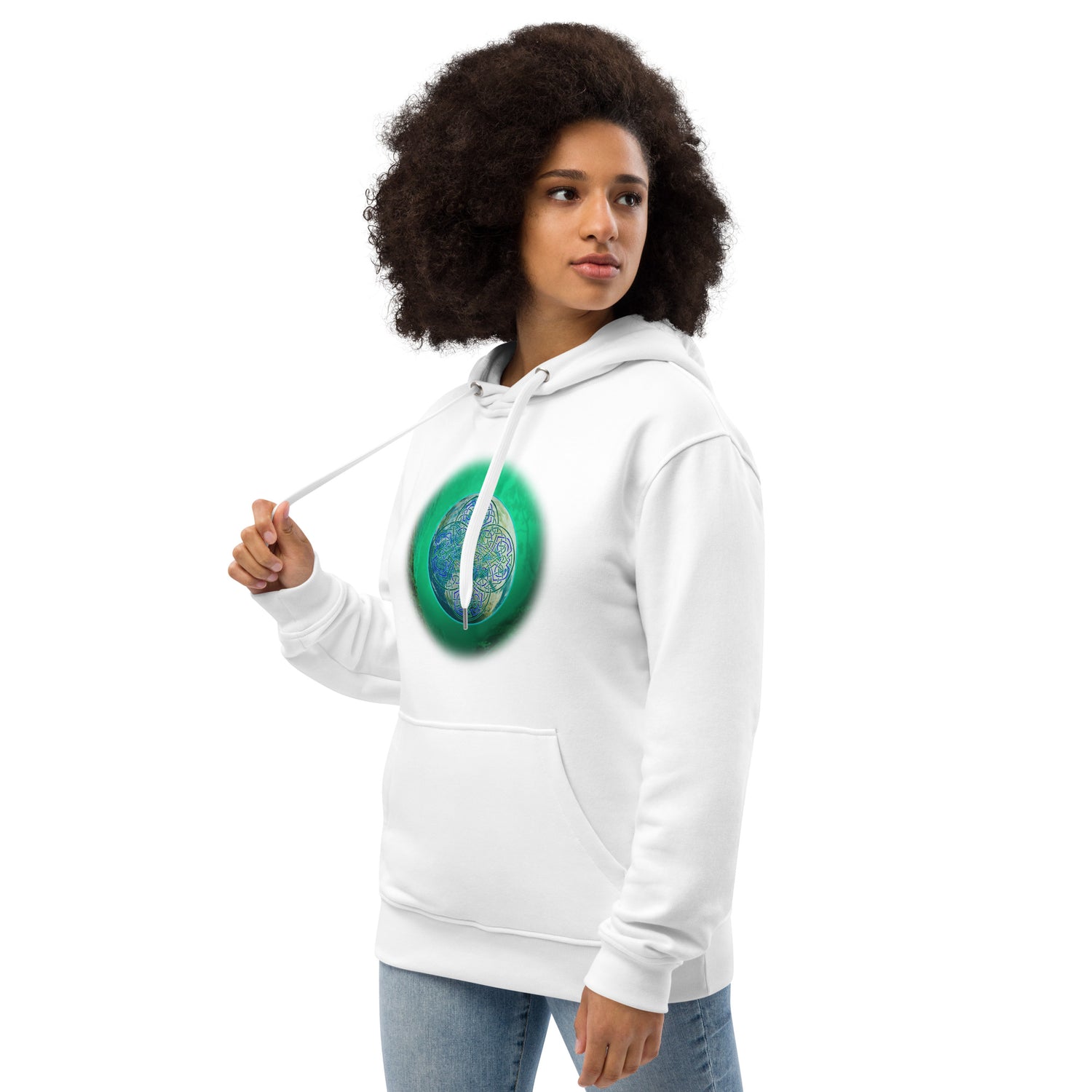 A young woman wearing a white Xigfireon graphic eco-friendly hoodie featuring the Deep Forest iteration of the `Reach Of The Spirit` Celtic knot design. The `Reach Of The Spirit` Celtic knot symbolizes our beautiful Mother Earth.