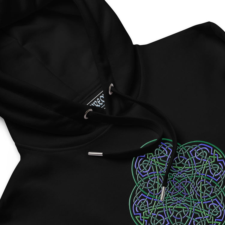 A close-up view of a black Xigfireon graphic eco-friendly hoodie featuring the Living Colour iteration of the `Reach Of The Spirit` Celtic knot design. The `Reach Of The Spirit` Celtic knot represents Earth.