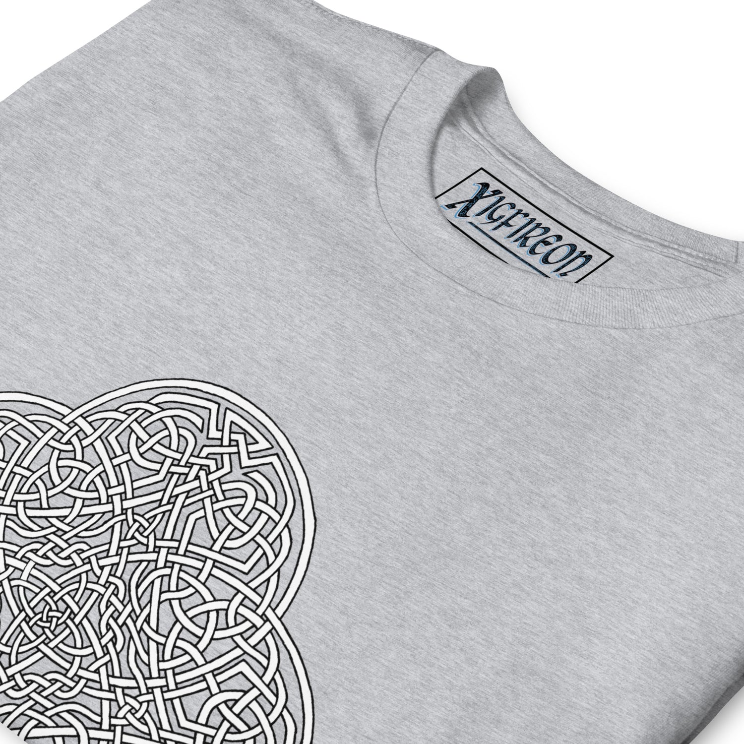 A close-up view of a sport grey Xigfireon graphic t-shirt featuring the Black & White Hollow iteration of the `Reach Of The Spirit` Celtic knot design. The `Reach Of The Spirit` Celtic knot is an Earth symbol.